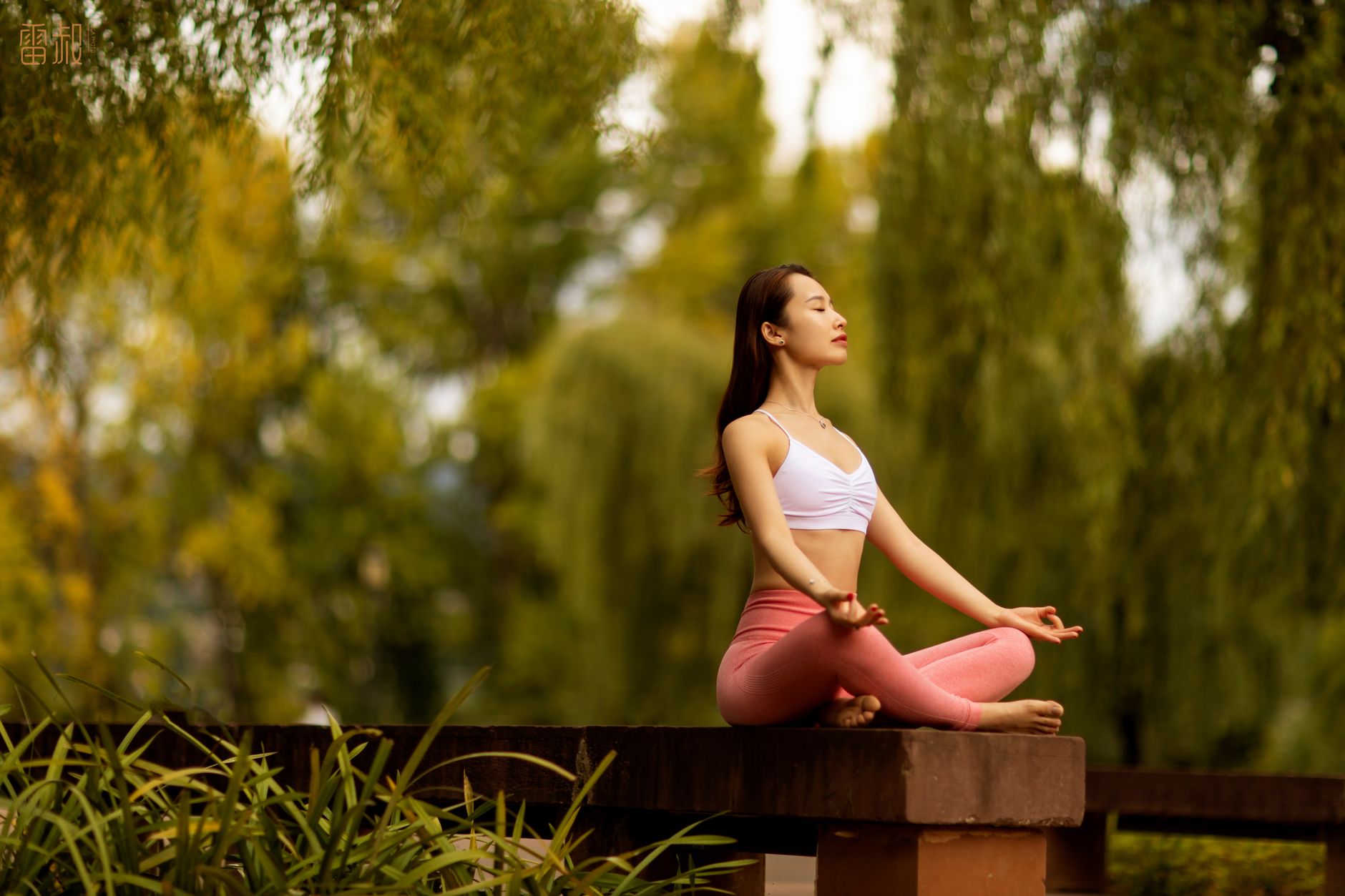woman doing a relaxation exercise in a park