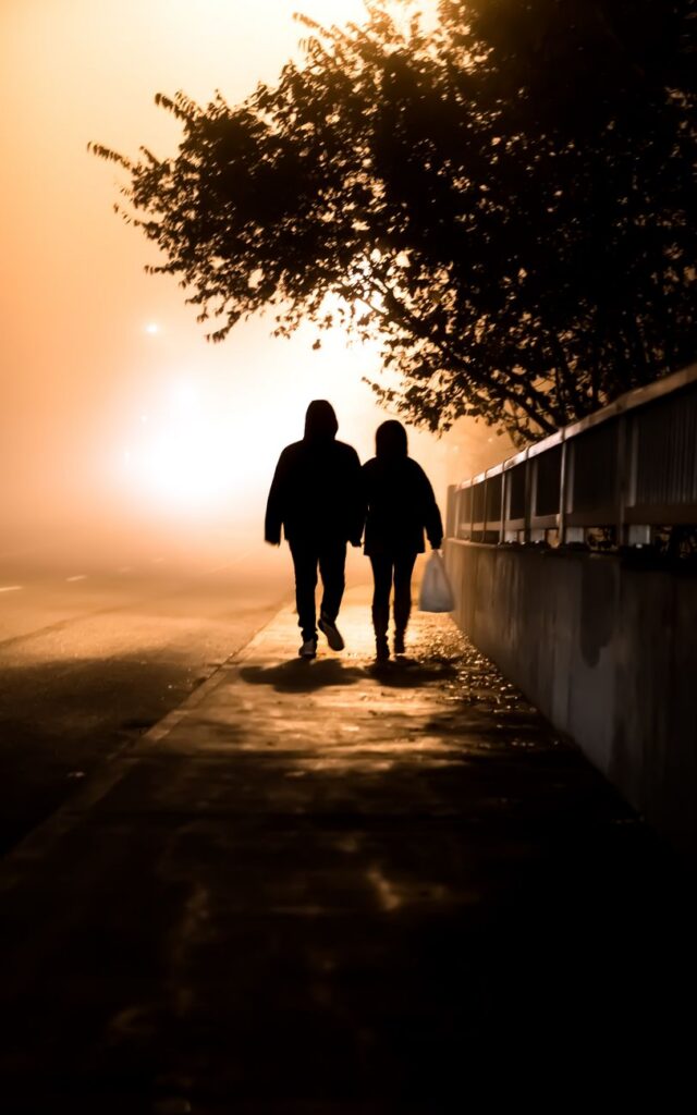 people walking on the sidewalk