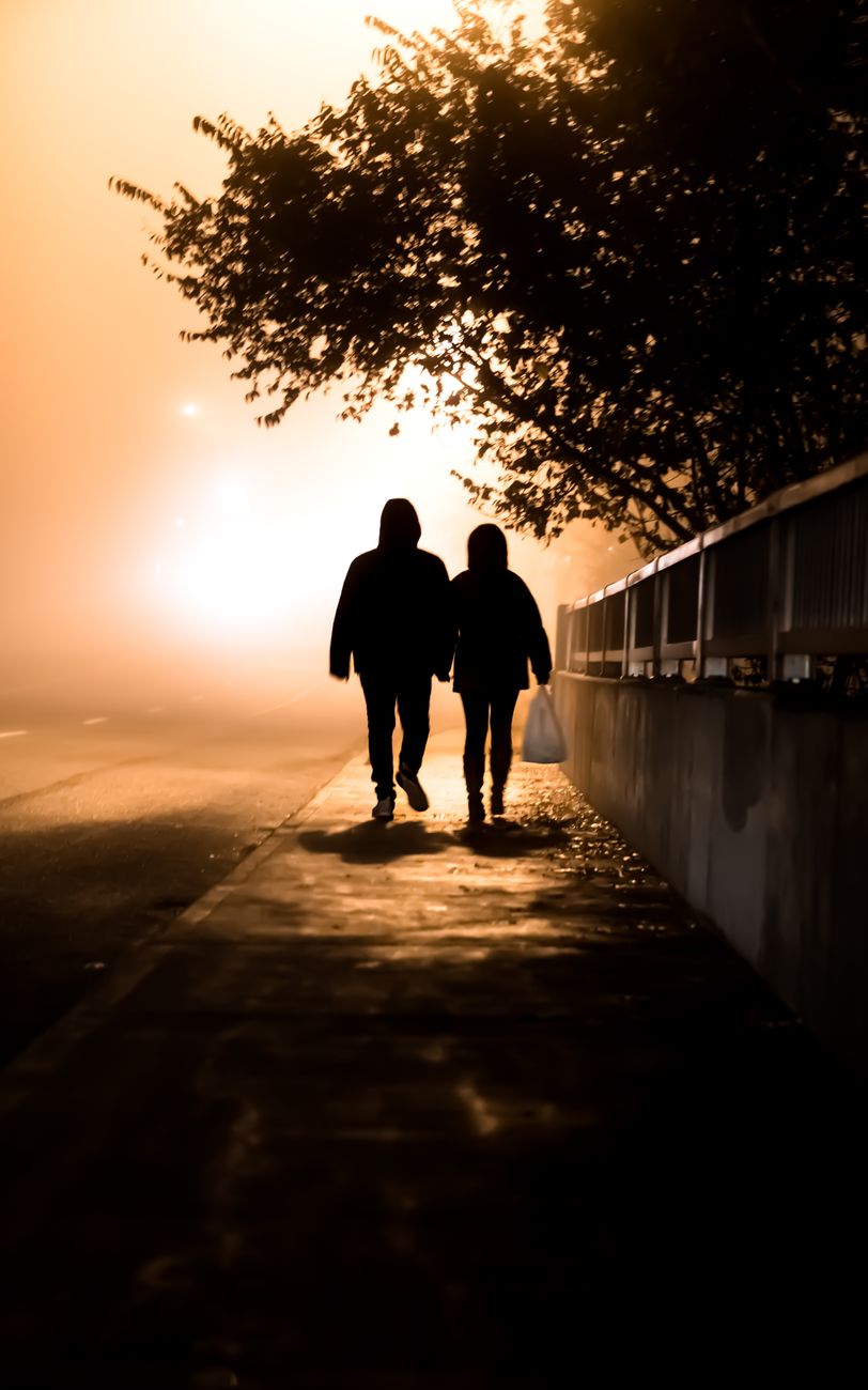 people walking on the sidewalk