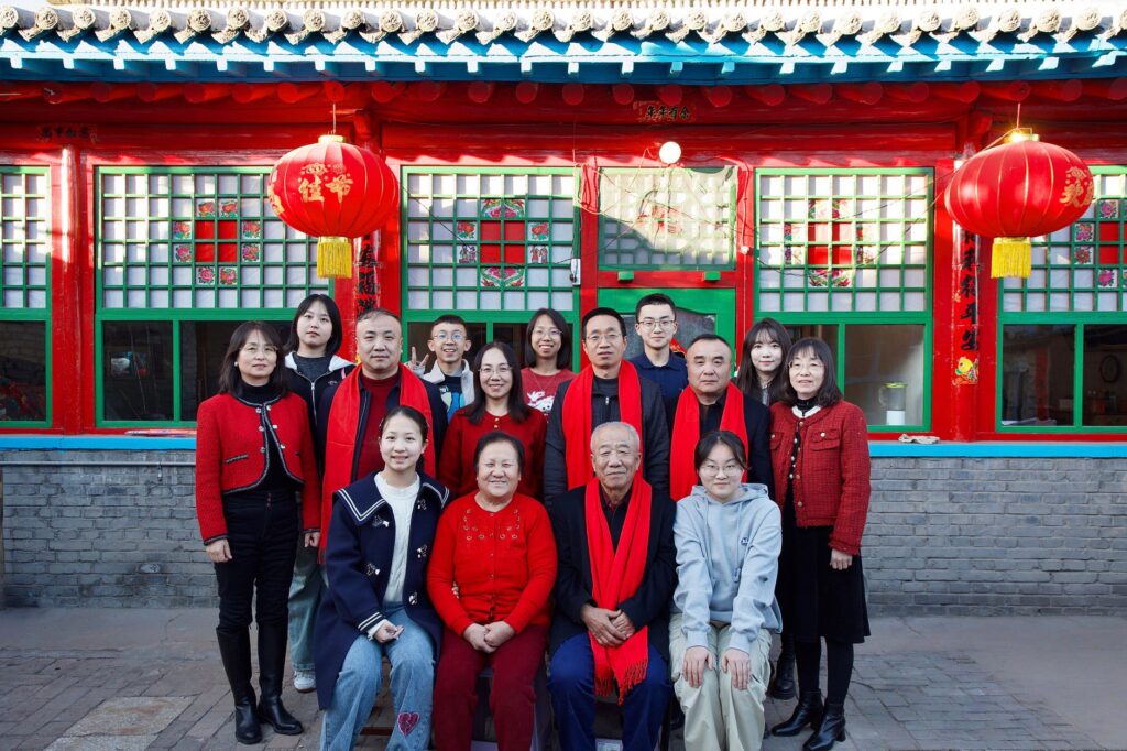 family portrait in traditional chinese attire outdoors