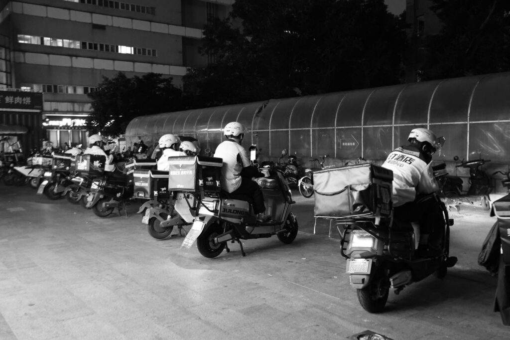 nighttime food delivery riders gathering for dispatch