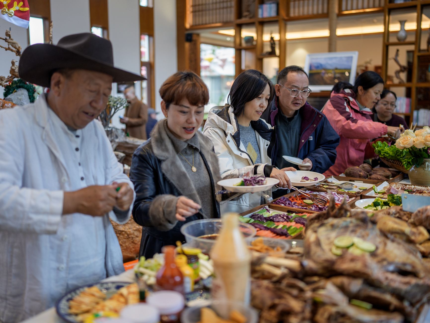 group of people enjoying buffet at indoor event